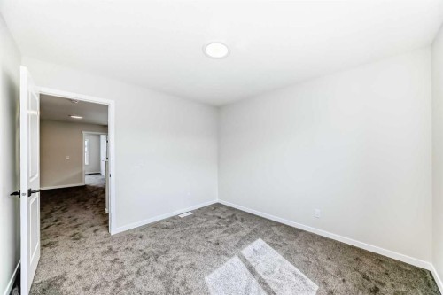 1069 Sawgrass Link Nw, Airdrie, AB - Indoor Photo Showing Other Room