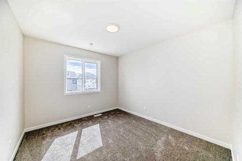 1069 Sawgrass Link Nw, Airdrie, AB - Indoor Photo Showing Other Room