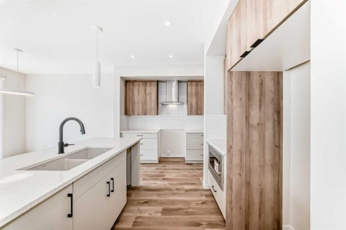 1069 Sawgrass Link Nw, Airdrie, AB - Indoor Photo Showing Kitchen With Double Sink