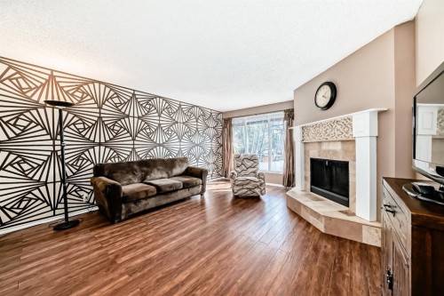 244 Whiteridge Place Ne, Calgary, AB - Indoor Photo Showing Living Room With Fireplace