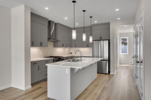 106 Corner Glen Grove Ne, Calgary, AB - Indoor Photo Showing Kitchen With Stainless Steel Kitchen With Double Sink With Upgraded Kitchen