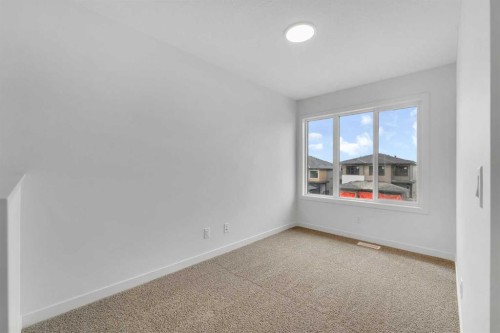 15 Heritage Heath, Cochrane, AB - Indoor Photo Showing Other Room
