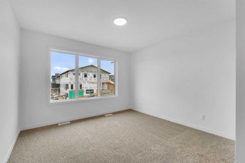 15 Heritage Heath, Cochrane, AB - Indoor Photo Showing Other Room