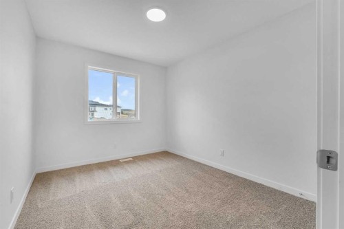 15 Heritage Heath, Cochrane, AB - Indoor Photo Showing Other Room