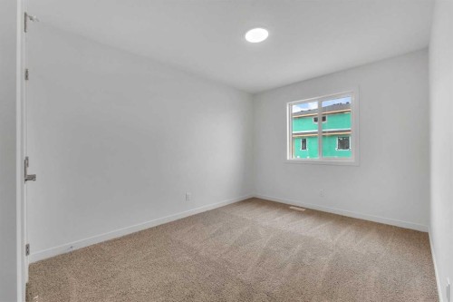15 Heritage Heath, Cochrane, AB - Indoor Photo Showing Other Room