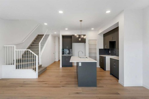15 Heritage Heath, Cochrane, AB - Indoor Photo Showing Kitchen With Upgraded Kitchen