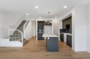 15 Heritage Heath, Cochrane, AB  - Indoor Photo Showing Kitchen With Upgraded Kitchen 