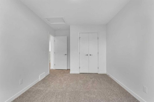 15 Heritage Heath, Cochrane, AB - Indoor Photo Showing Other Room