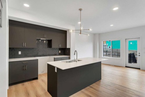 15 Heritage Heath, Cochrane, AB - Indoor Photo Showing Kitchen With Double Sink With Upgraded Kitchen