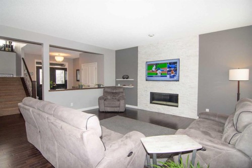 119 Auburn Bay Avenue Se, Calgary, AB - Indoor Photo Showing Living Room With Fireplace