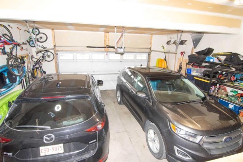 119 Auburn Bay Avenue Se, Calgary, AB - Indoor Photo Showing Garage