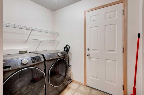 41 Chapman Close Se, Calgary, AB - Indoor Photo Showing Laundry Room