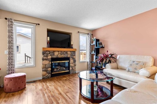 310 Somerset Drive Sw, Calgary, AB - Indoor Photo Showing Living Room With Fireplace