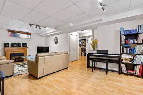 310 Somerset Drive Sw, Calgary, AB - Indoor With Fireplace