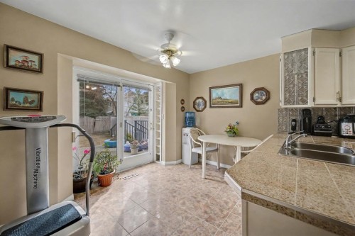 983 Woodbine Boulevard Sw, Calgary, AB - Indoor Photo Showing Kitchen With Double Sink