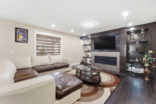 171 Coral Springs Park Ne, Calgary, AB - Indoor Photo Showing Living Room With Fireplace