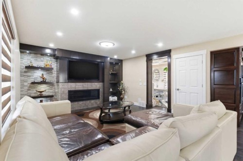 171 Coral Springs Park Ne, Calgary, AB - Indoor Photo Showing Living Room With Fireplace