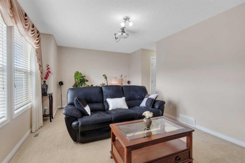 32 Panatella Row Nw, Calgary, AB - Indoor Photo Showing Living Room