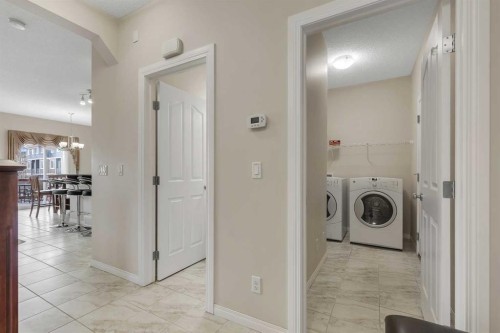 32 Panatella Row Nw, Calgary, AB - Indoor Photo Showing Laundry Room