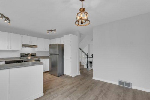 220 Cedarbrook Bay Sw, Calgary, AB - Indoor Photo Showing Kitchen With Double Sink