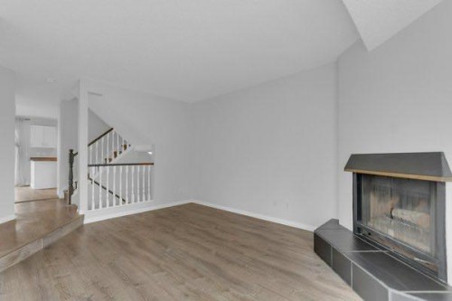220 Cedarbrook Bay Sw, Calgary, AB - Indoor With Fireplace