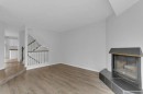 220 Cedarbrook Bay Sw, Calgary, AB  - Indoor With Fireplace 