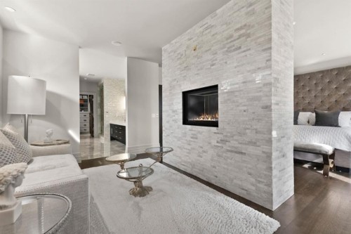 122 Aspen Ridge Place Sw, Calgary, AB - Indoor Photo Showing Living Room With Fireplace