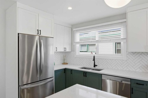 559 Deerpath Court Se, Calgary, AB - Indoor Photo Showing Kitchen With Stainless Steel Kitchen With Double Sink With Upgraded Kitchen