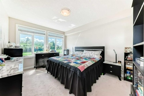210-1005A Westmount Drive, Strathmore, AB - Indoor Photo Showing Bedroom