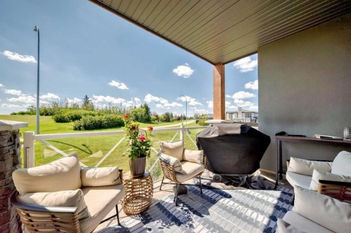 210-1005A Westmount Drive, Strathmore, AB - Outdoor With Deck Patio Veranda With Exterior