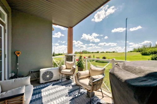 210-1005A Westmount Drive, Strathmore, AB - Outdoor With Deck Patio Veranda With Exterior