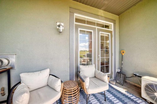 210-1005A Westmount Drive, Strathmore, AB - Outdoor With Deck Patio Veranda With Exterior