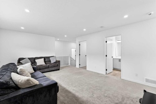 41 Copperhead Road Se, Calgary, AB - Indoor Photo Showing Living Room