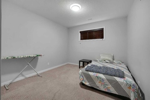 216 Carringvue Manor Nw, Calgary, AB - Indoor Photo Showing Bedroom
