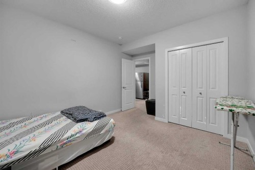 216 Carringvue Manor Nw, Calgary, AB - Indoor Photo Showing Bedroom