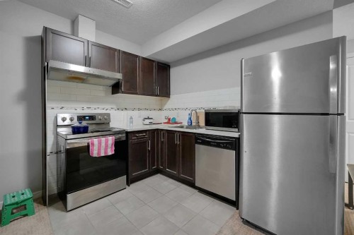 216 Carringvue Manor Nw, Calgary, AB - Indoor Photo Showing Kitchen With Stainless Steel Kitchen