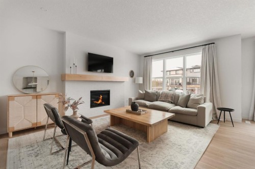 29 Cranbrook Park Se, Calgary, AB - Indoor Photo Showing Living Room With Fireplace