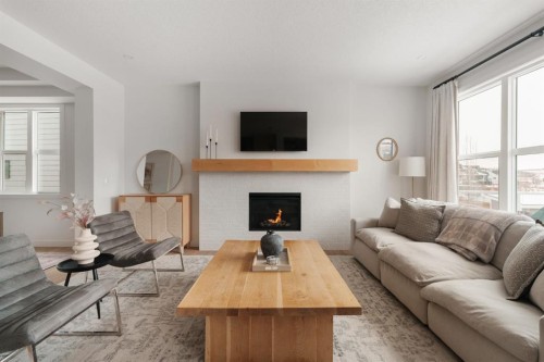 29 Cranbrook Park Se, Calgary, AB - Indoor Photo Showing Living Room With Fireplace
