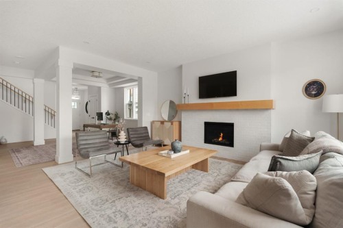29 Cranbrook Park Se, Calgary, AB - Indoor Photo Showing Living Room With Fireplace