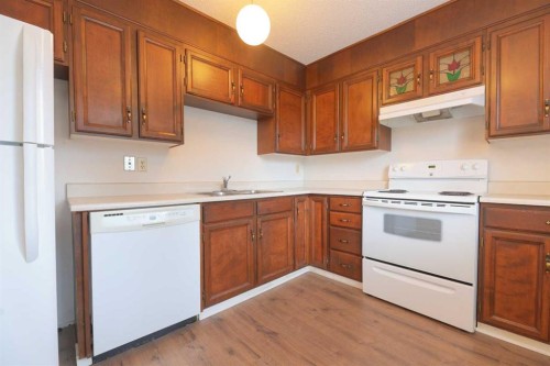 6501 Coach Hill Road Sw, Calgary, AB - Indoor Photo Showing Kitchen With Double Sink