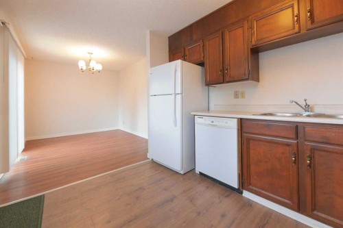 6501 Coach Hill Road Sw, Calgary, AB - Indoor Photo Showing Kitchen With Double Sink