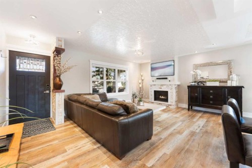 6 Grove Hill Place Sw, Calgary, AB - Indoor Photo Showing Living Room With Fireplace