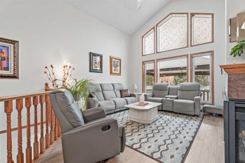 30 Cranston Place Se, Calgary, AB - Indoor Photo Showing Living Room With Fireplace