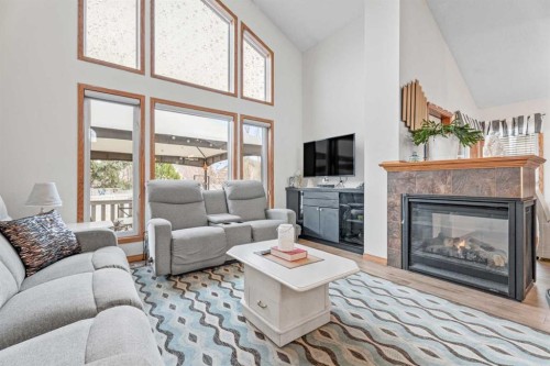 30 Cranston Place Se, Calgary, AB - Indoor Photo Showing Living Room With Fireplace