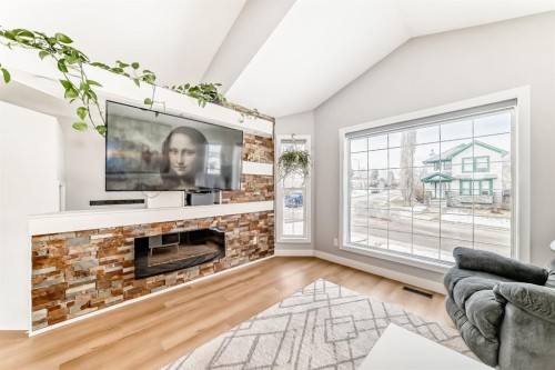 45 Hidden Hills Way Nw, Calgary, AB - Indoor Photo Showing Living Room With Fireplace