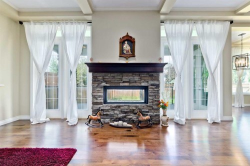 60 Elmont Rise Sw, Calgary, AB - Indoor Photo Showing Living Room With Fireplace