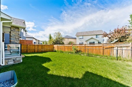 60 Elmont Rise Sw, Calgary, AB - Outdoor With Backyard