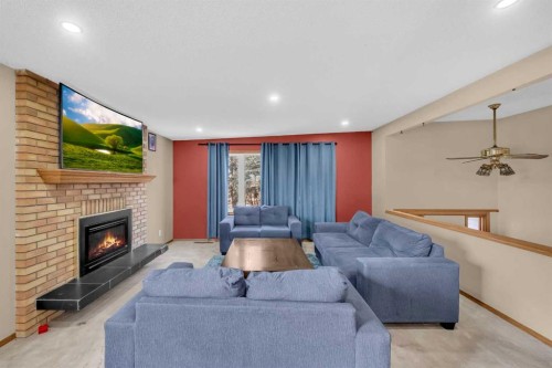 255192 Range Road 282, Delacour, AB - Indoor Photo Showing Living Room With Fireplace