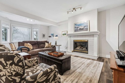 67 Scimitar Heath Nw, Calgary, AB - Indoor Photo Showing Living Room With Fireplace