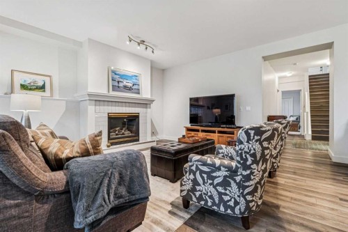 67 Scimitar Heath Nw, Calgary, AB - Indoor Photo Showing Living Room With Fireplace